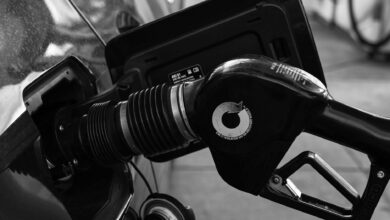 gas pump nozzle in the cars filler neck